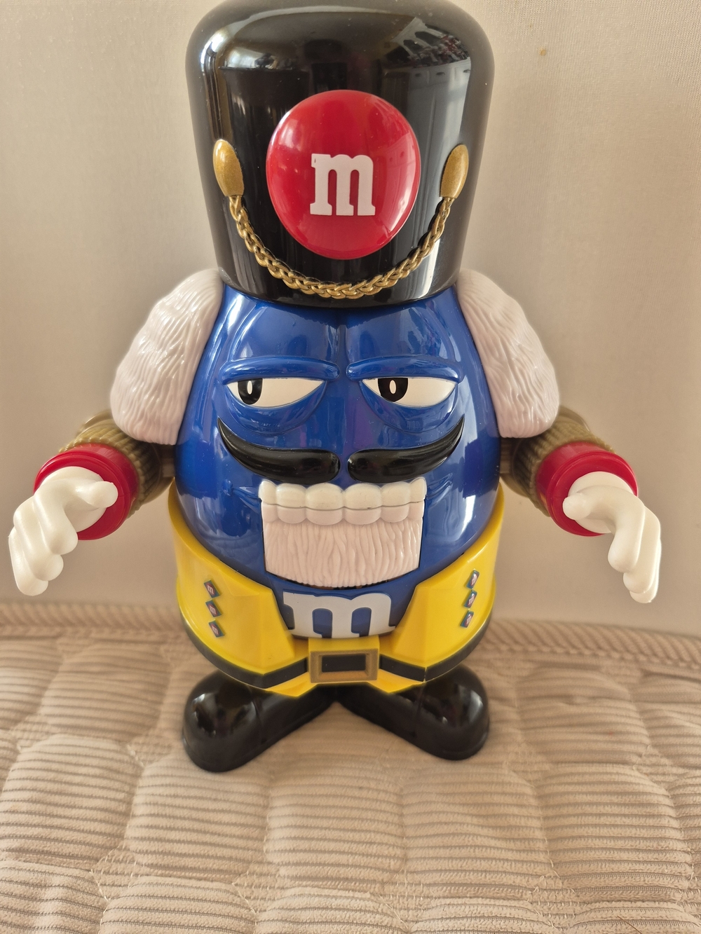 M&M'S Blue Soldier Figure with Yellow Uniform and Black Hat